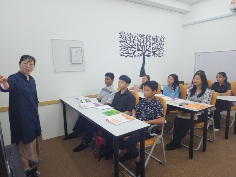 Teacher with attentive students in classroom