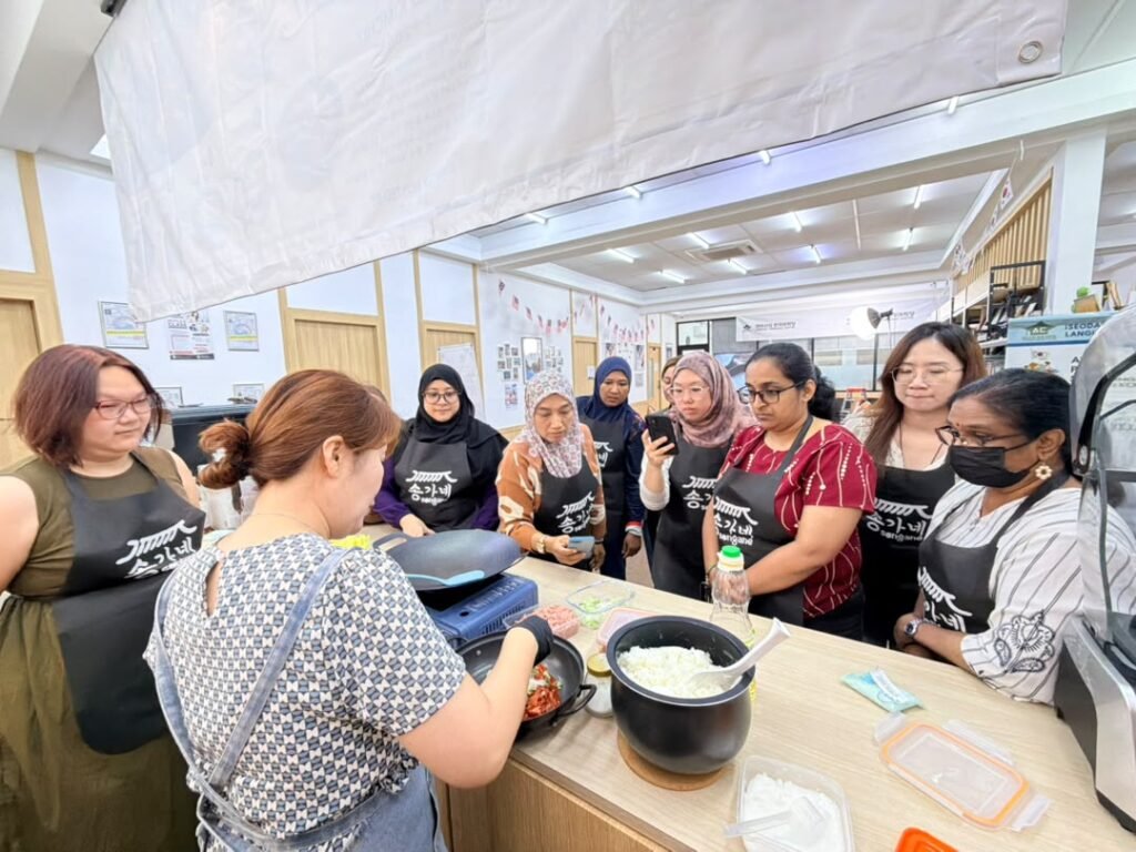Participants making kimchi together